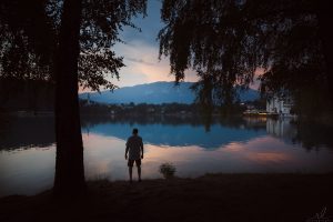 Man on edge of Lake Bled on vacation