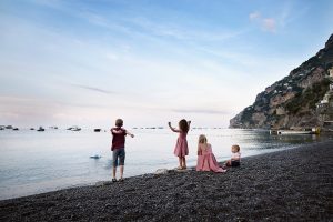 Family vacation photo of kids at Positano beach