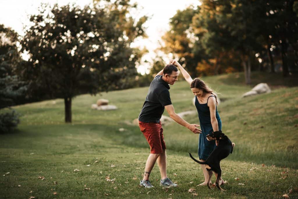 dog and owners in woods